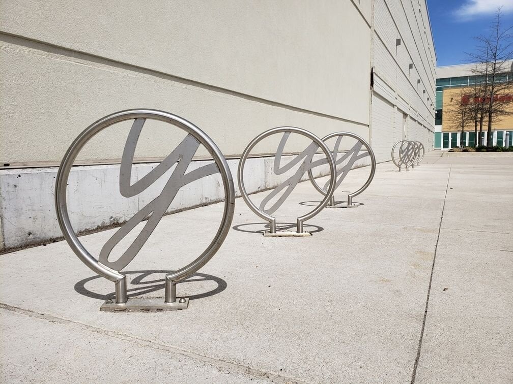 Custom stainless steel bicycle rings installed at Yorkdale Mall in Toronto.