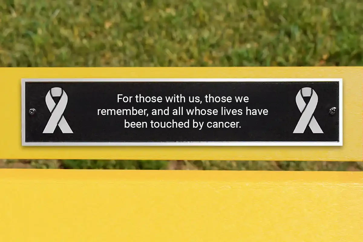Cast aluminum memorial plaque for Cancer Awareness Bench