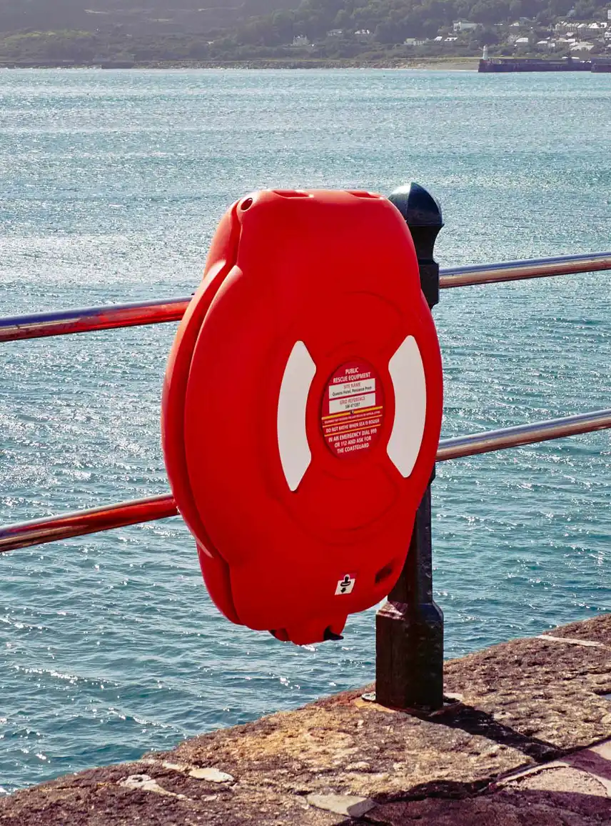 Guardian lifebuoy housing installed along a municipal waterfront boardwalk for public water safety