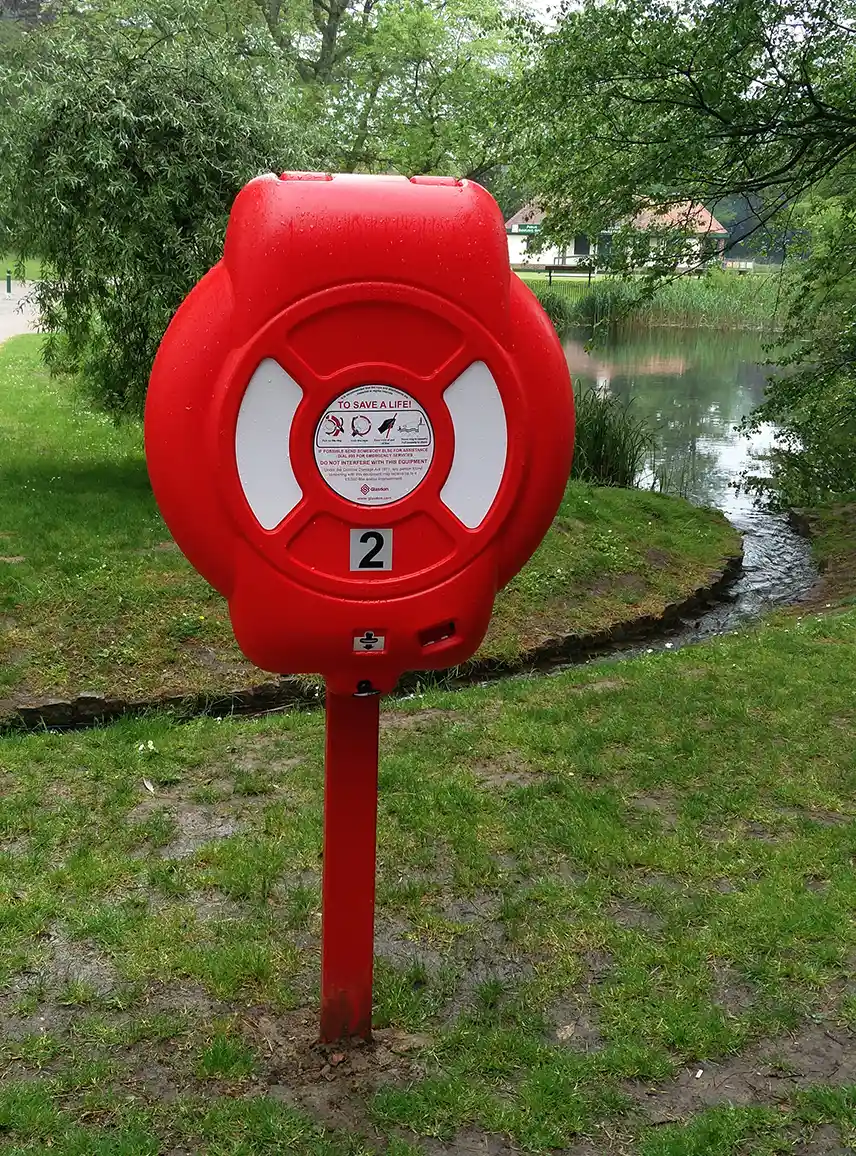 Water safety lifebuoy housing installed in a park pond