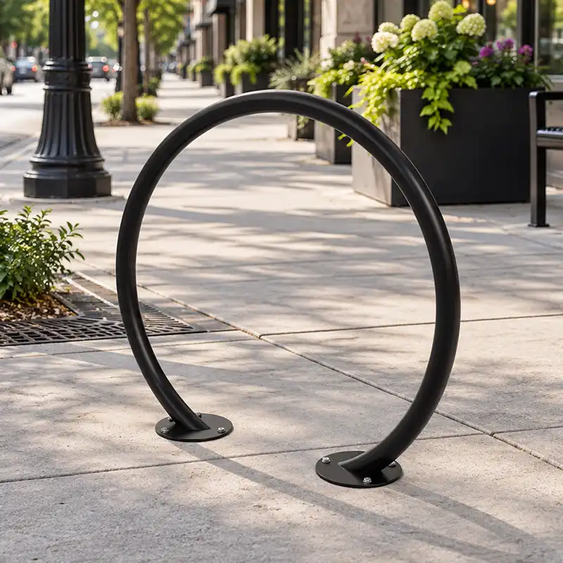 Commercial self-watering planter with vibrant pink flowers used for streetscape landscaping and public spaces.