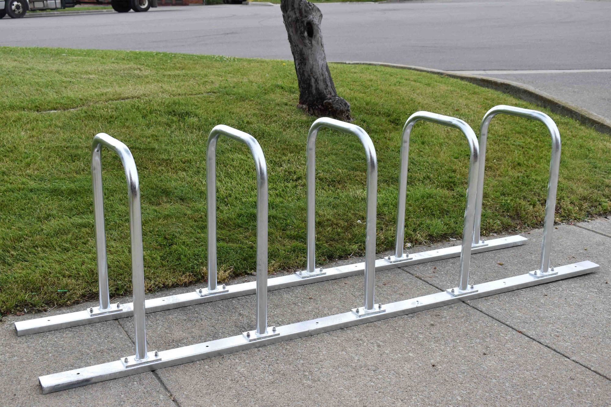 Commercial bike rack rail system for secure, organized bicycle parking in public spaces